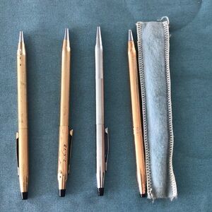 3 cross pens. One cross pencil.